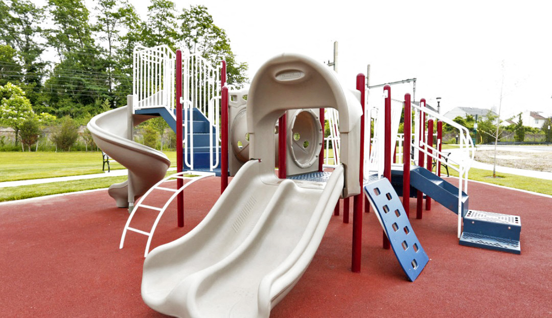 a playground with a slide and other play equipment