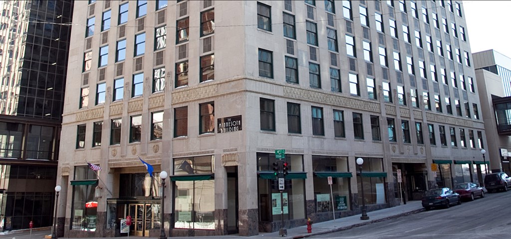 a large building on the corner of a city street