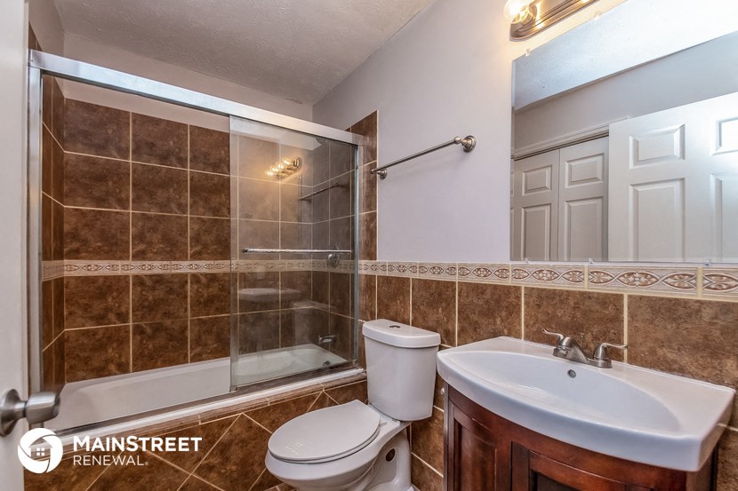 a bathroom with a sink toilet and a shower