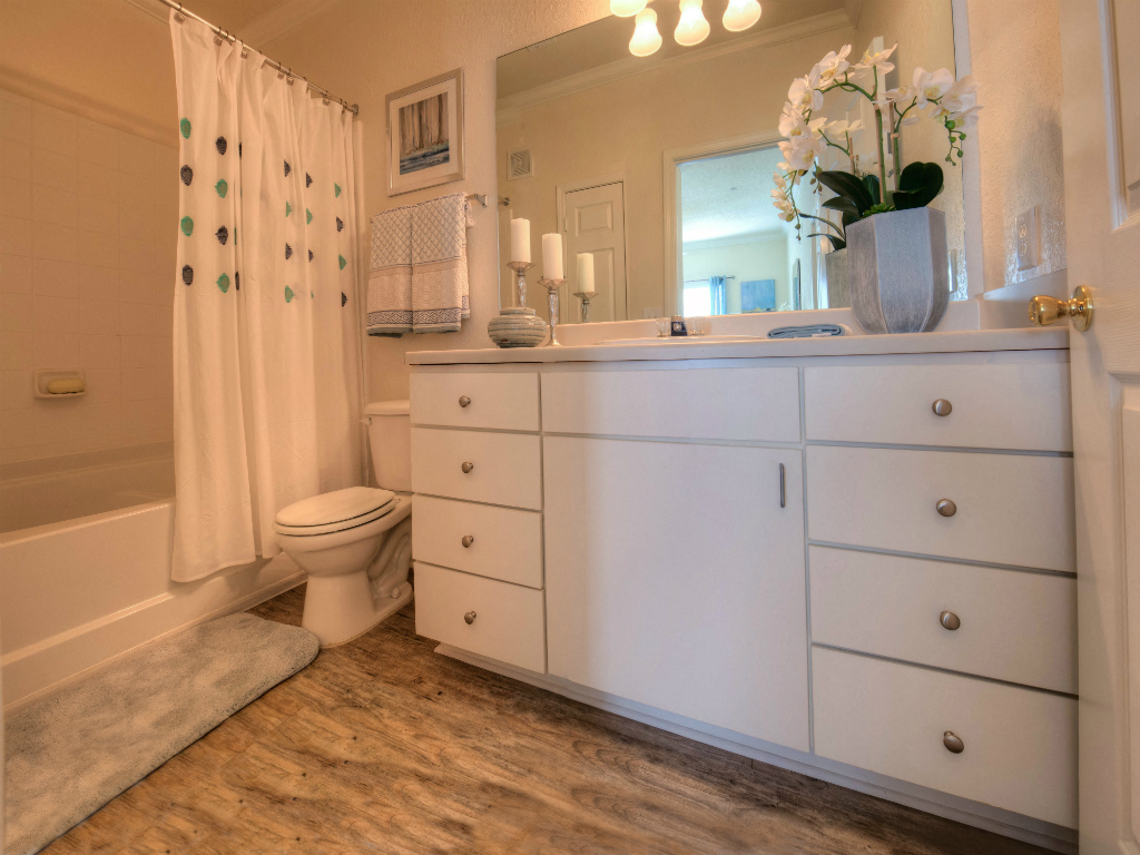 Every bathroom contains ample cabinet storage to keep clutter at bay.