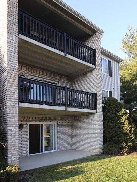 a view of a building with two balconies on the side of it