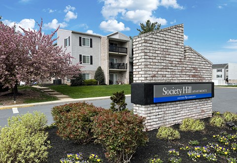 an apartment building with a sign that reads apartments