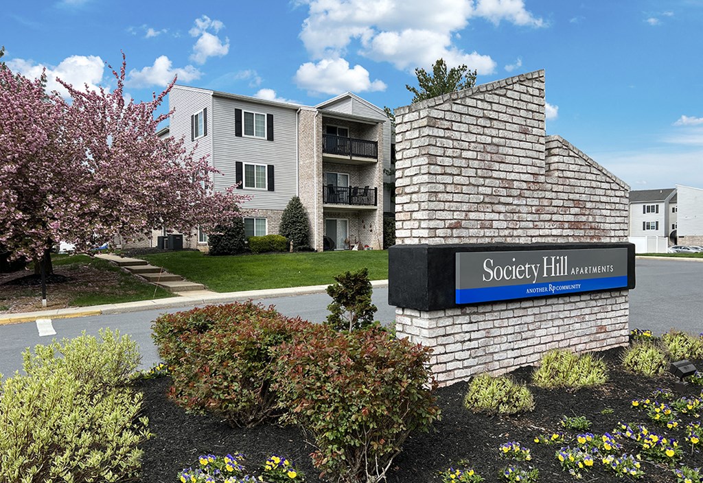 an apartment building with a sign that reads apartments