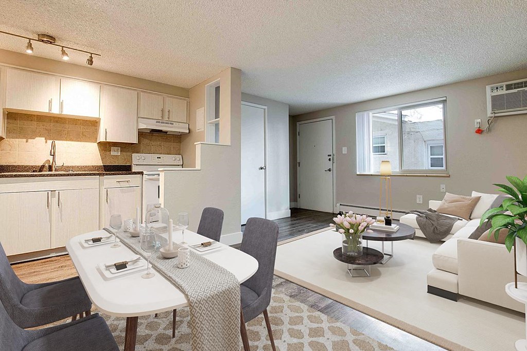 an open living room and kitchen with a dining table