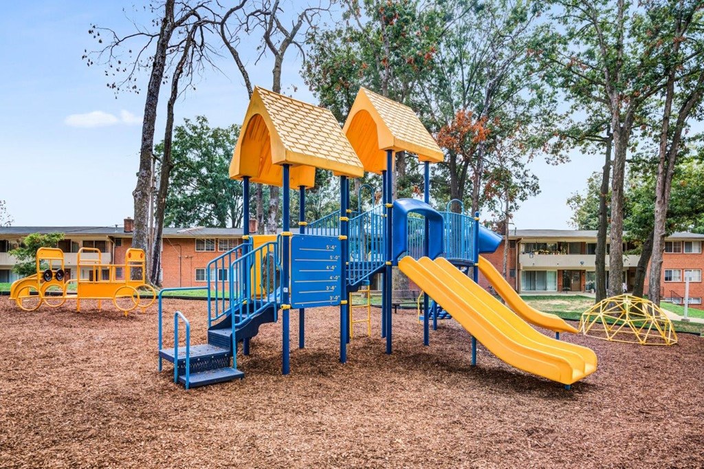 our playground is equipped with a large blue and yellow slide