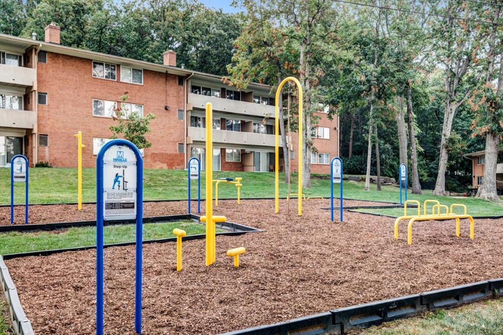 a playground in front of an apartment building