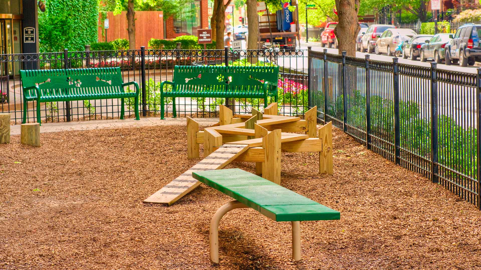 Several pieces of dog agility equipment are set within the private dog park just north of the 1360 Lake Shore Drive apartment tower.