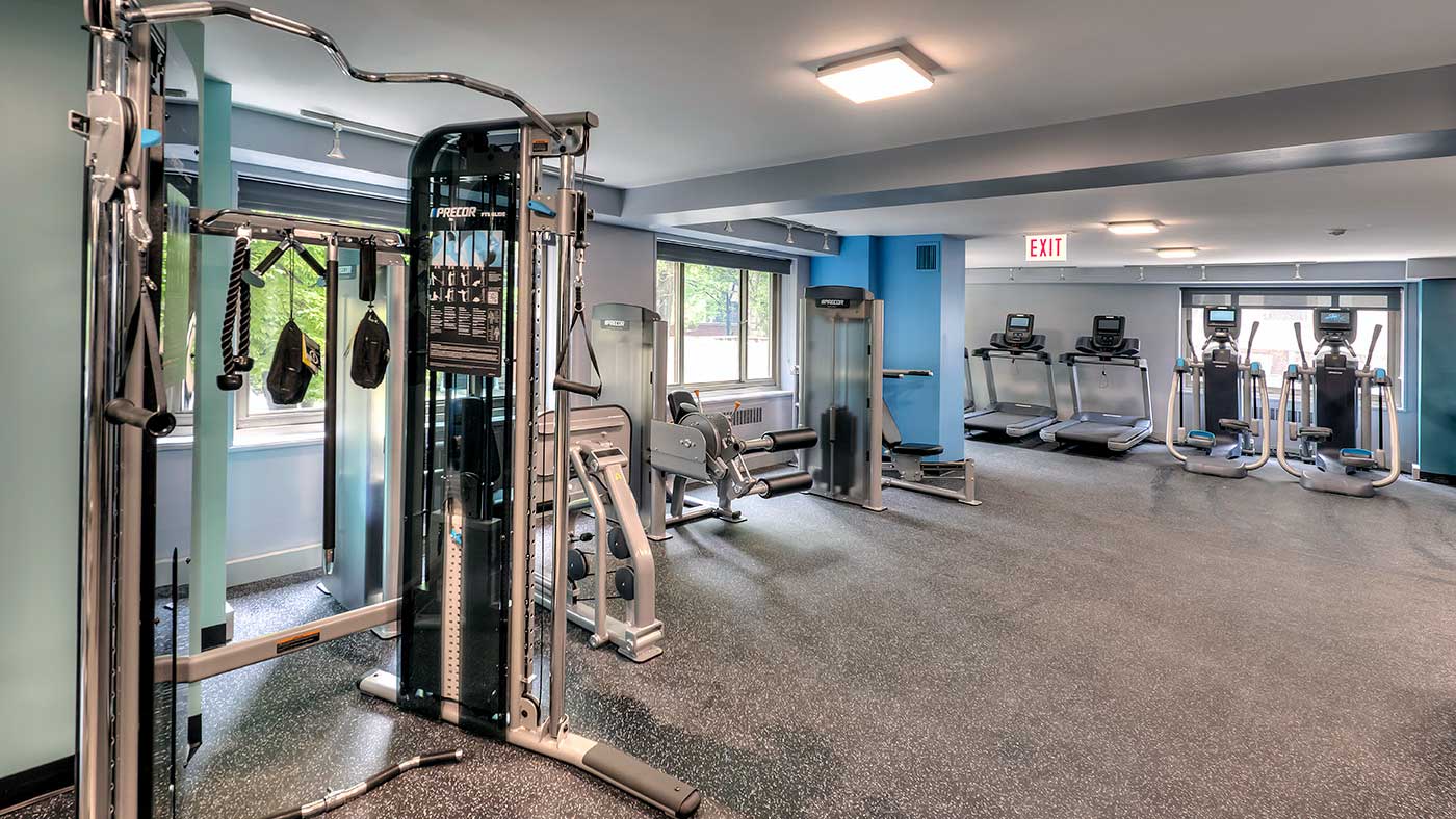 Inside one of the fitness centers at 1350-1360 Lake Shore Drive. Various weight machines are seen on the left with treadmills and elliptical machines along the far wall.