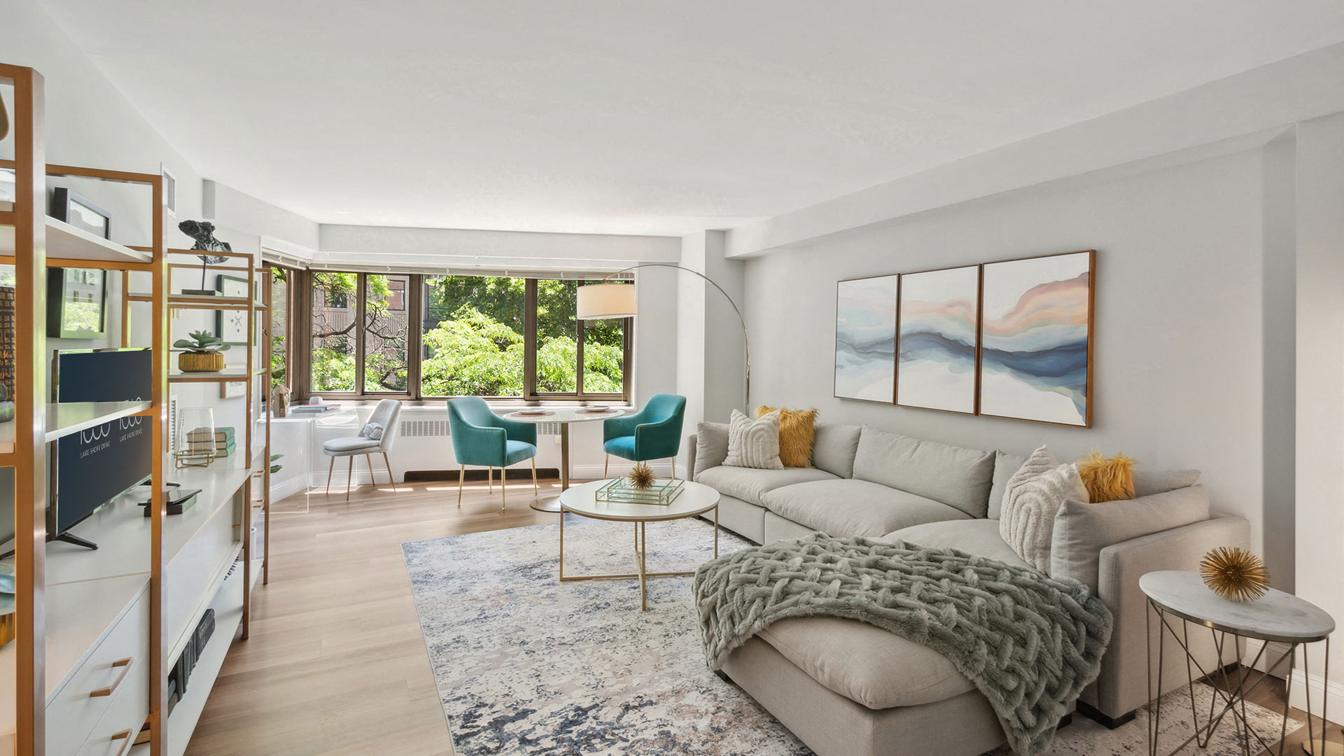 a living room with a white couch and a rug
