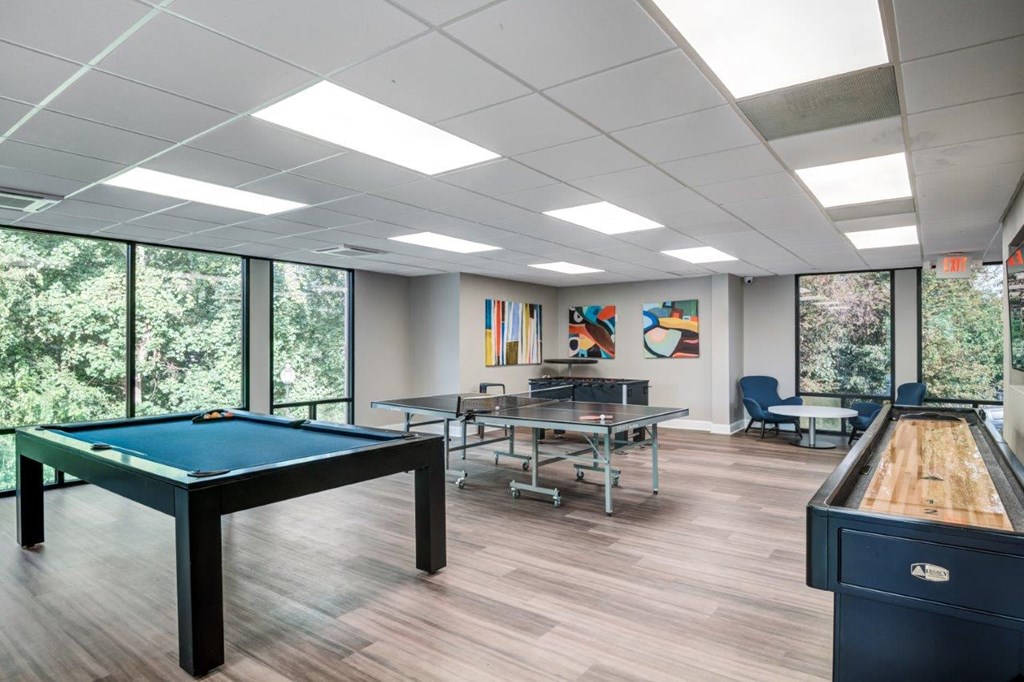 a game room with a pool table and ping pong