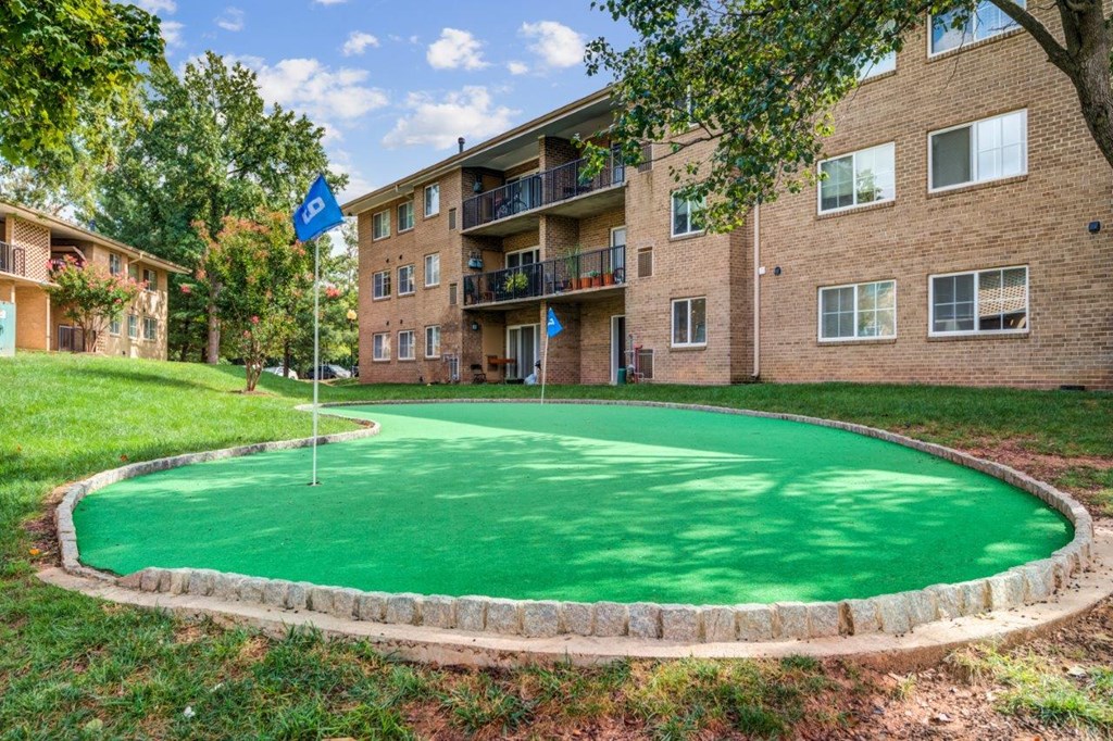 our apartments offer a putting green in front of our building