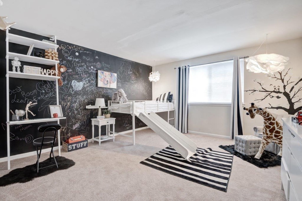 a black chalkboard wall in a bedroom with a white