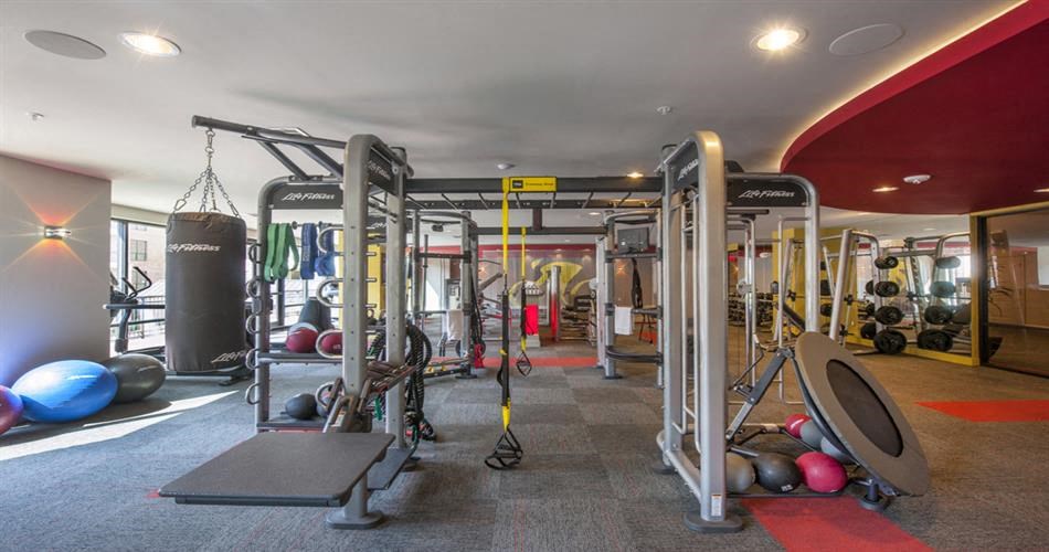 the gym is equipped with weights and other gym equipment