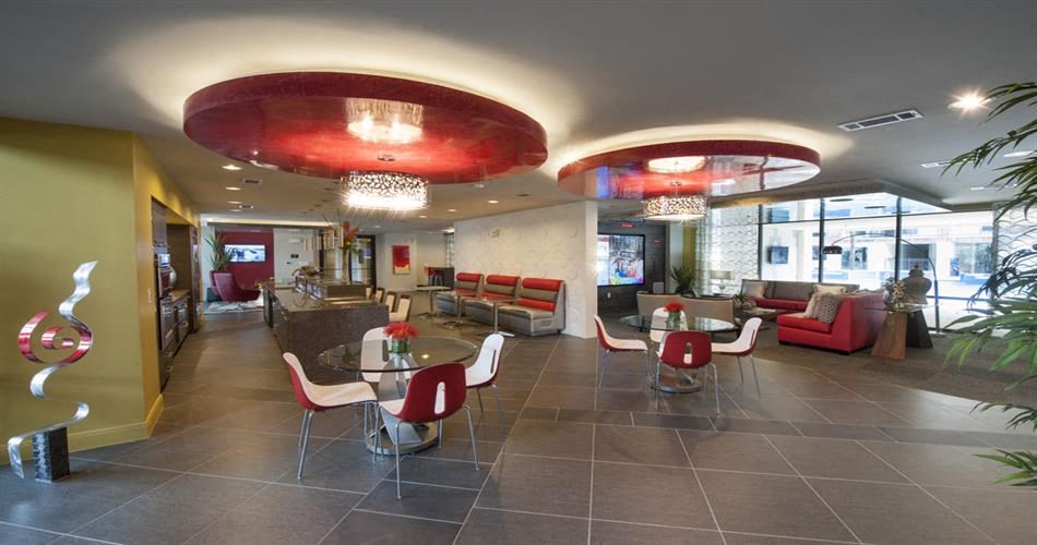 the lobby of a restaurant with tables and chairs