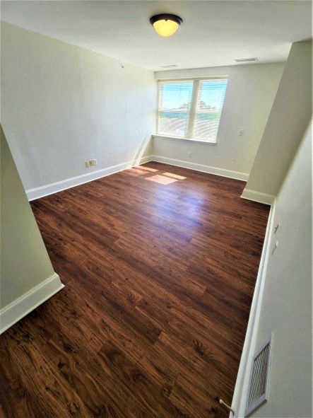 a empty room with a hard wood floor