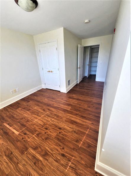 a empty room with a hard wood floor