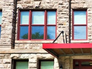 the front of a building with a red door