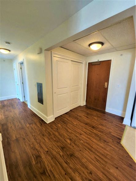a empty room with a wooden floor and a door