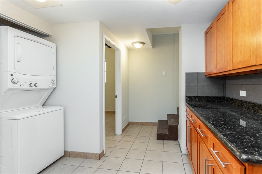 a kitchen with a washer and a dryer in it