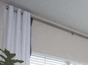 a bedroom with a bed and a ceiling fan