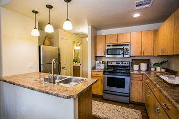 Full Gourmet Kitchen with Stainless Steel Appliances at 85323 Apartment