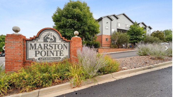 Marston Pointe Apartments sign in front of a building.