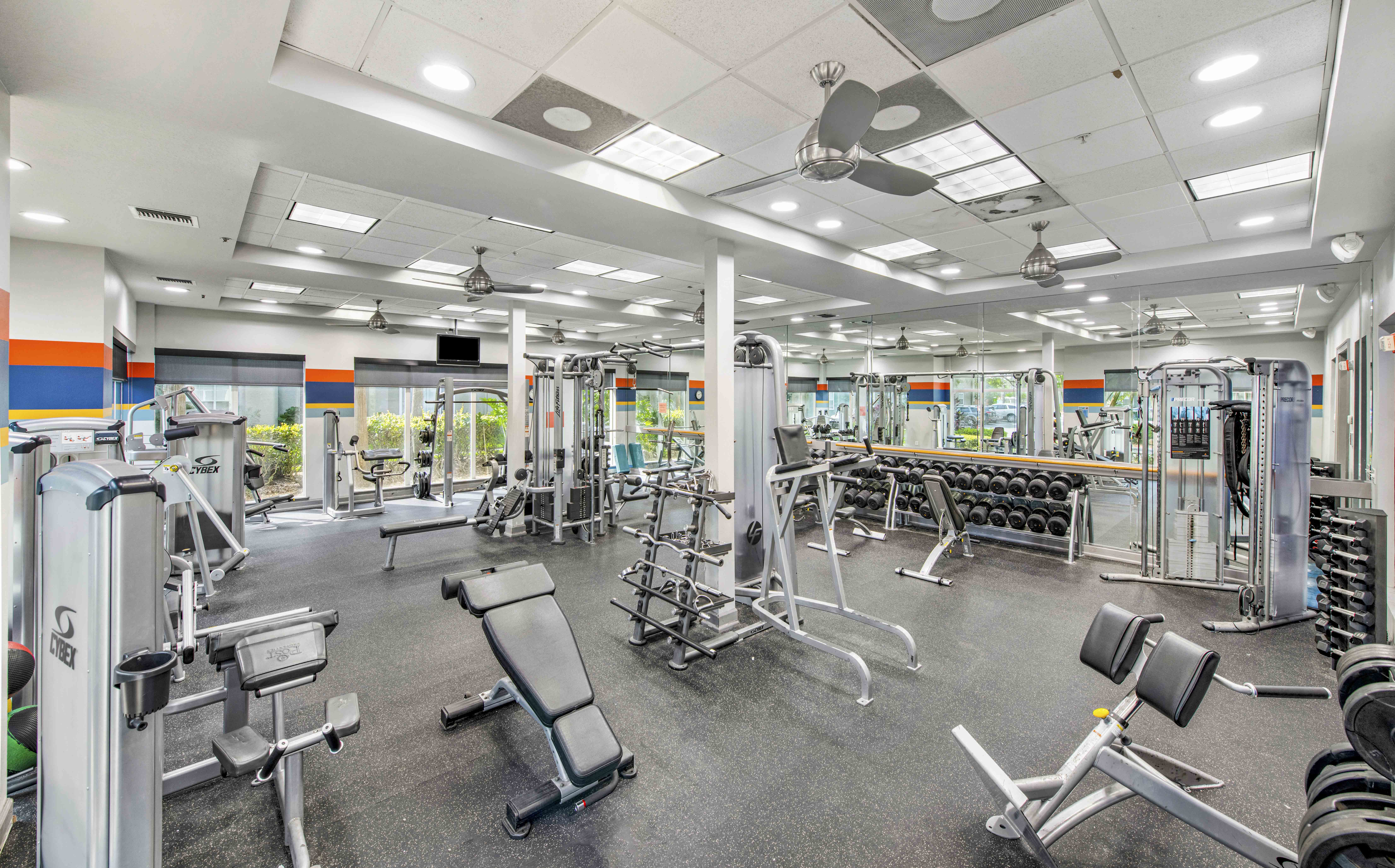 a gym with weights machines and other exercise equipment