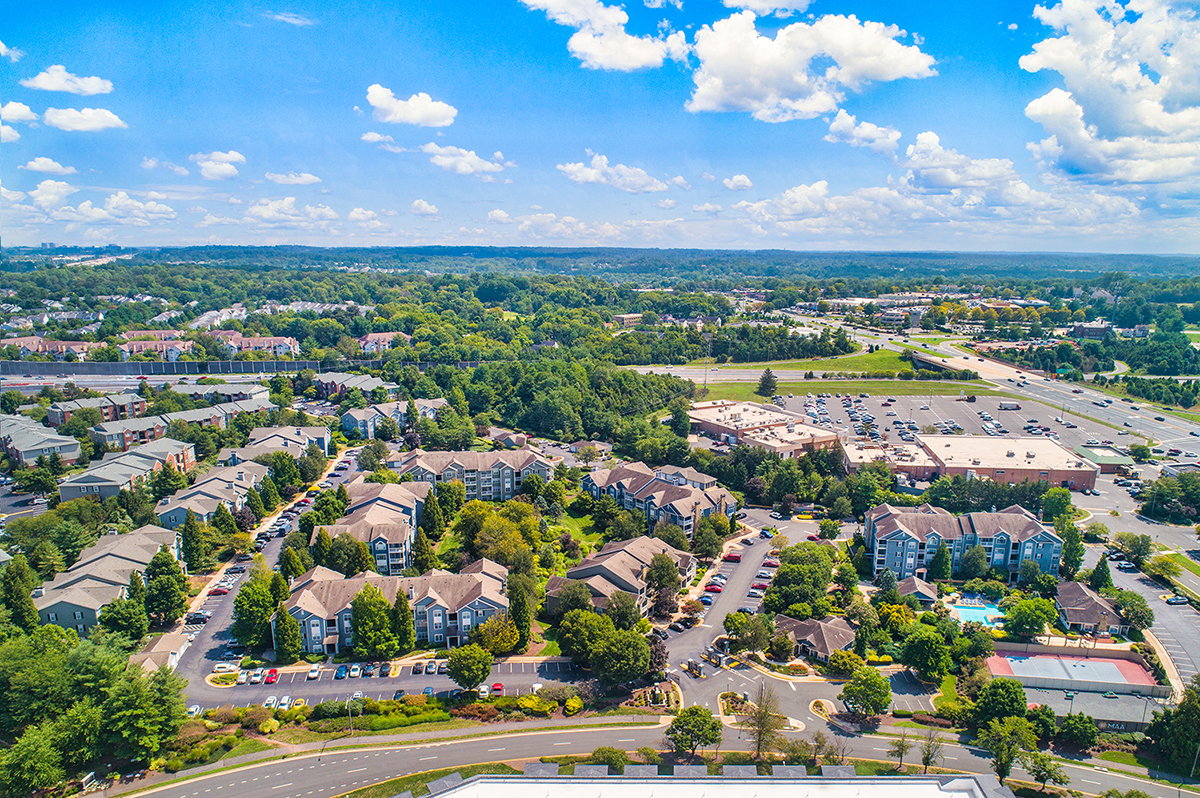 an aerial view of a suburb of a city with houses and trees