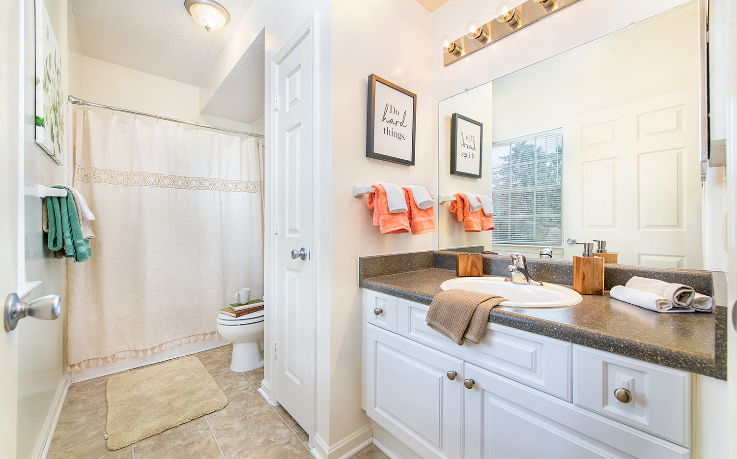 a bathroom with a sink and a shower and a toilet