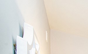a bedroom with a large bed and a ceiling fan