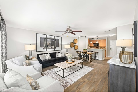 A living room with a white couch and a coffee table.