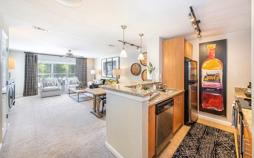a kitchen with a counter top and a refrigerator
