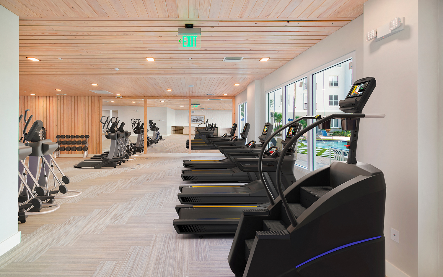 a row of treadmills in the gym at aria resort and spa