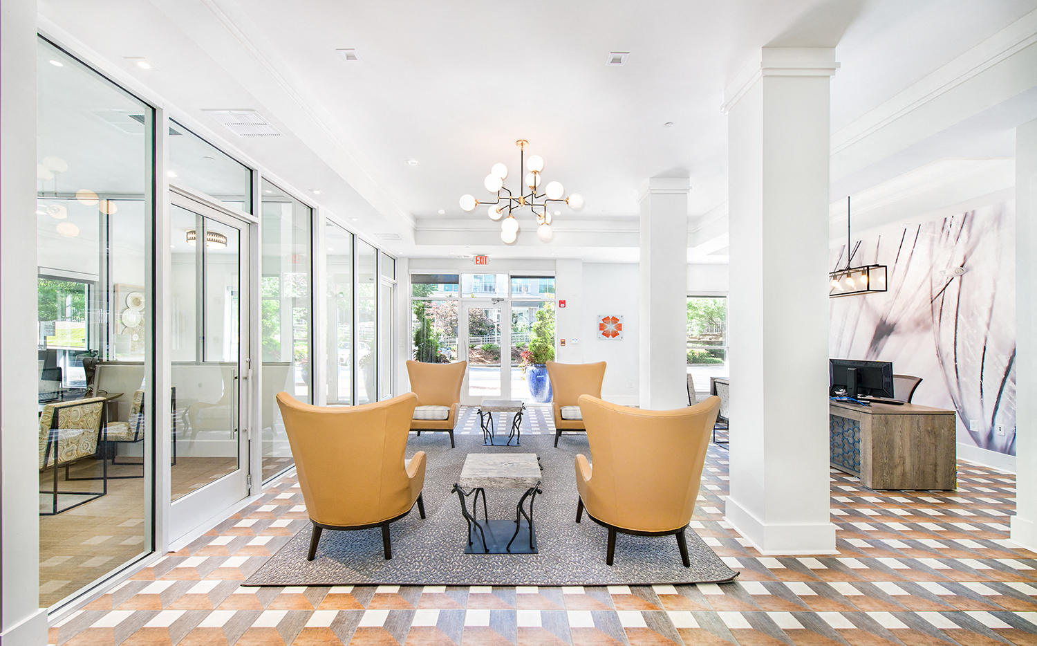 a dining room with a table and chairs and a lobby with glass doors