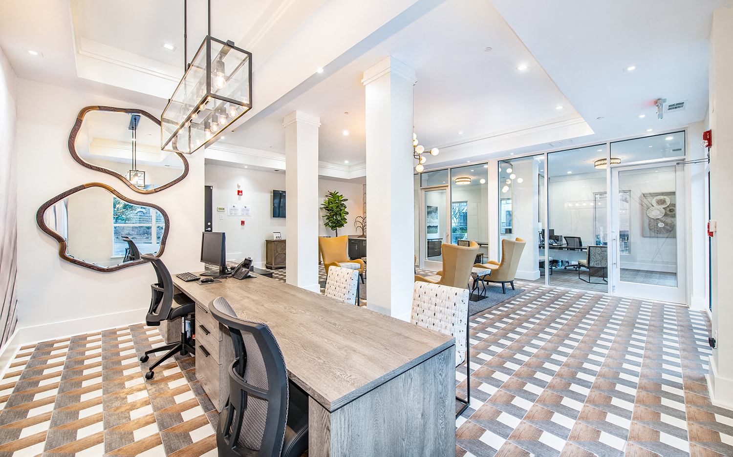 an office with a wooden desk and a checkered floor