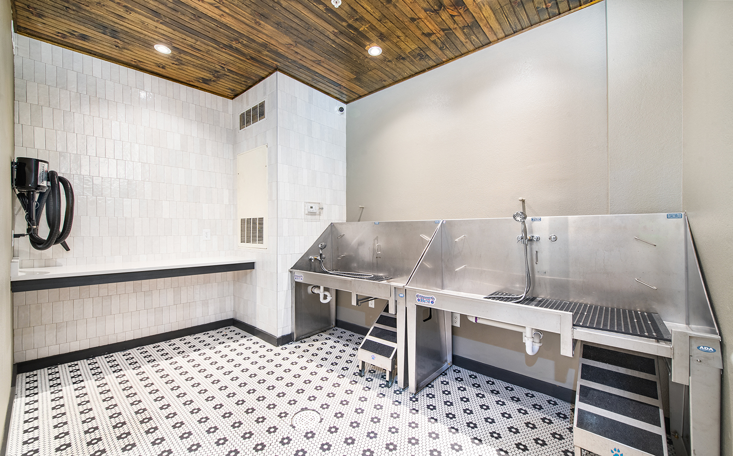 a commercial kitchen with stainless steel appliances and a sink