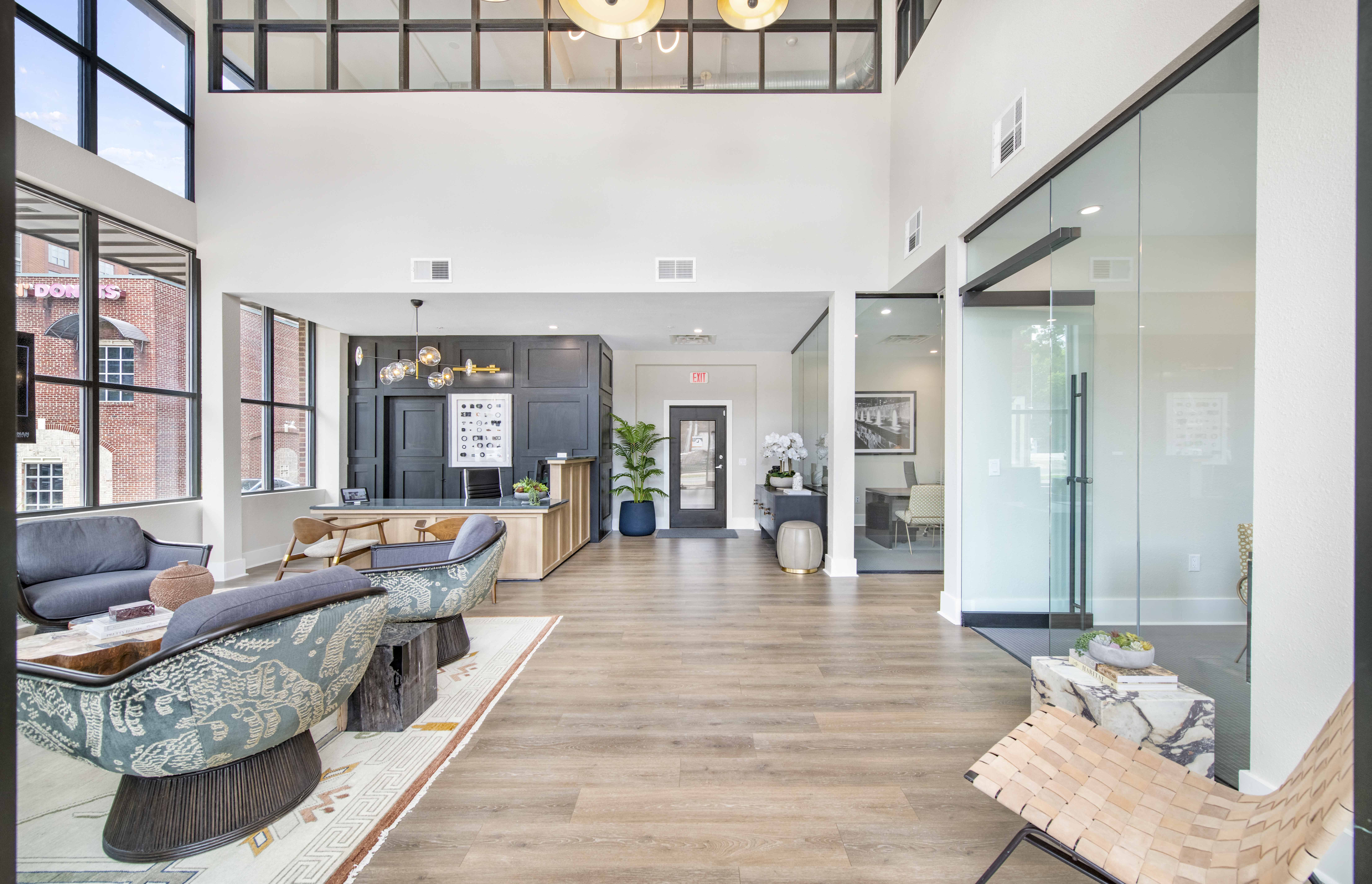 a living room with furniture and a large glass door