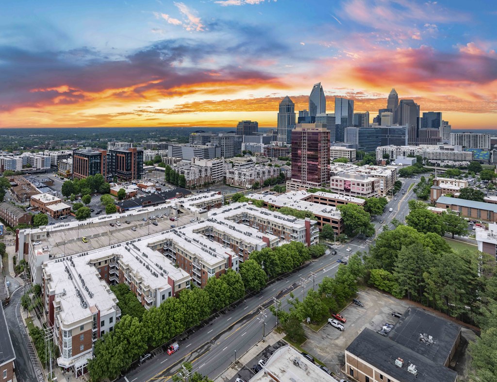 an aerial view of the city at sunset