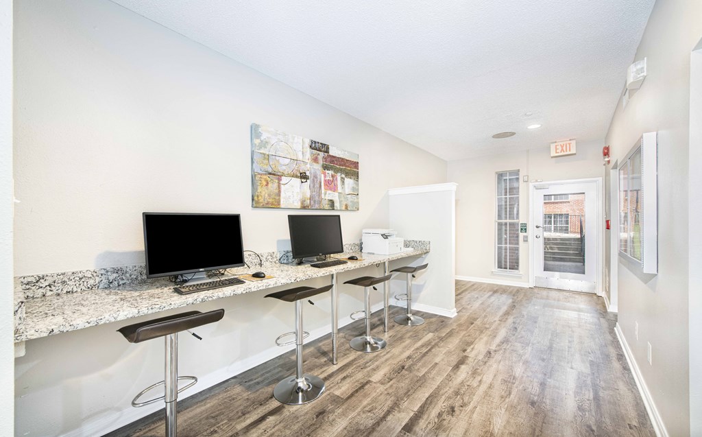 A modern kitchen with a bar area and a view of the outside.