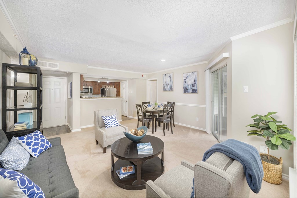 A living room with a grey couch and a coffee table.