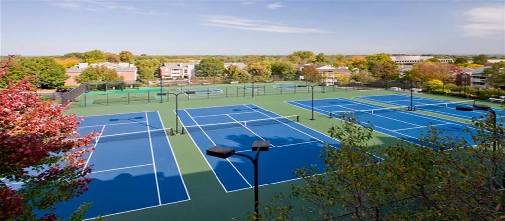 an aerial view of the tennis courts at the apartments for rent