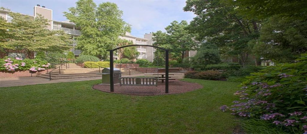 a park with a picnic table and a swing