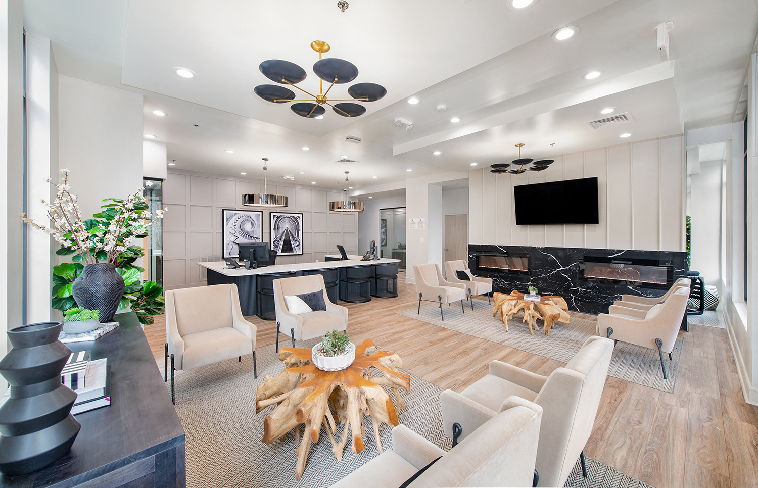 a living room with a fireplace and a table with chairs