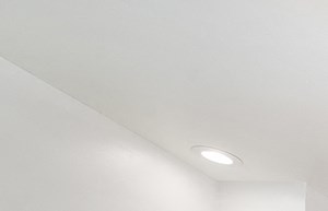 a conference room with a large white table and chairs