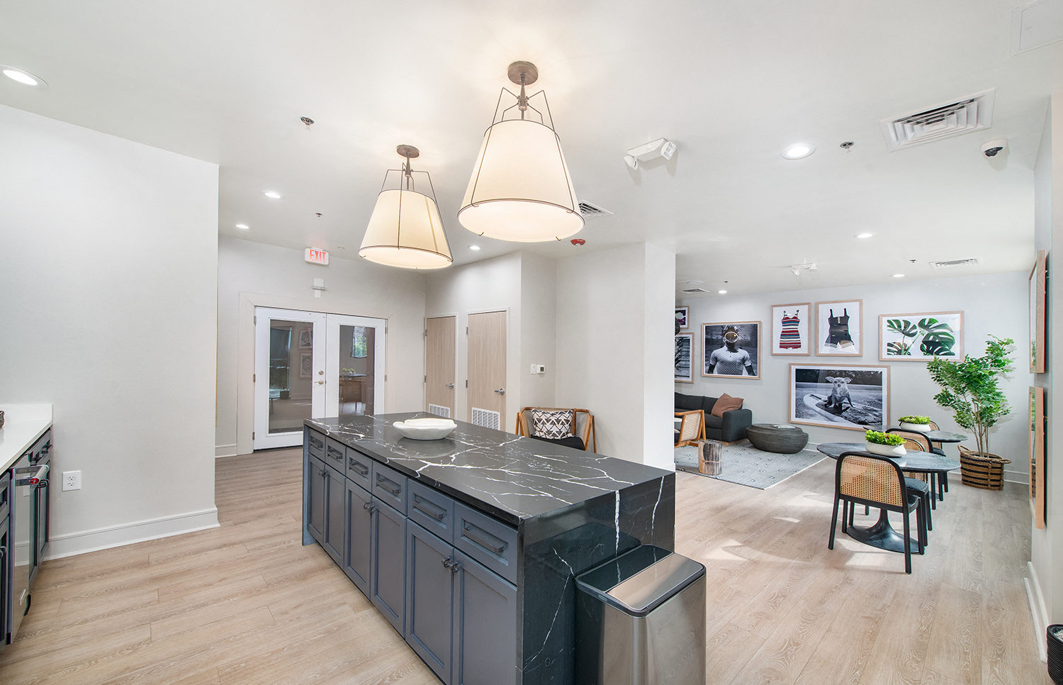 a kitchen with a large island in the middle of a living room