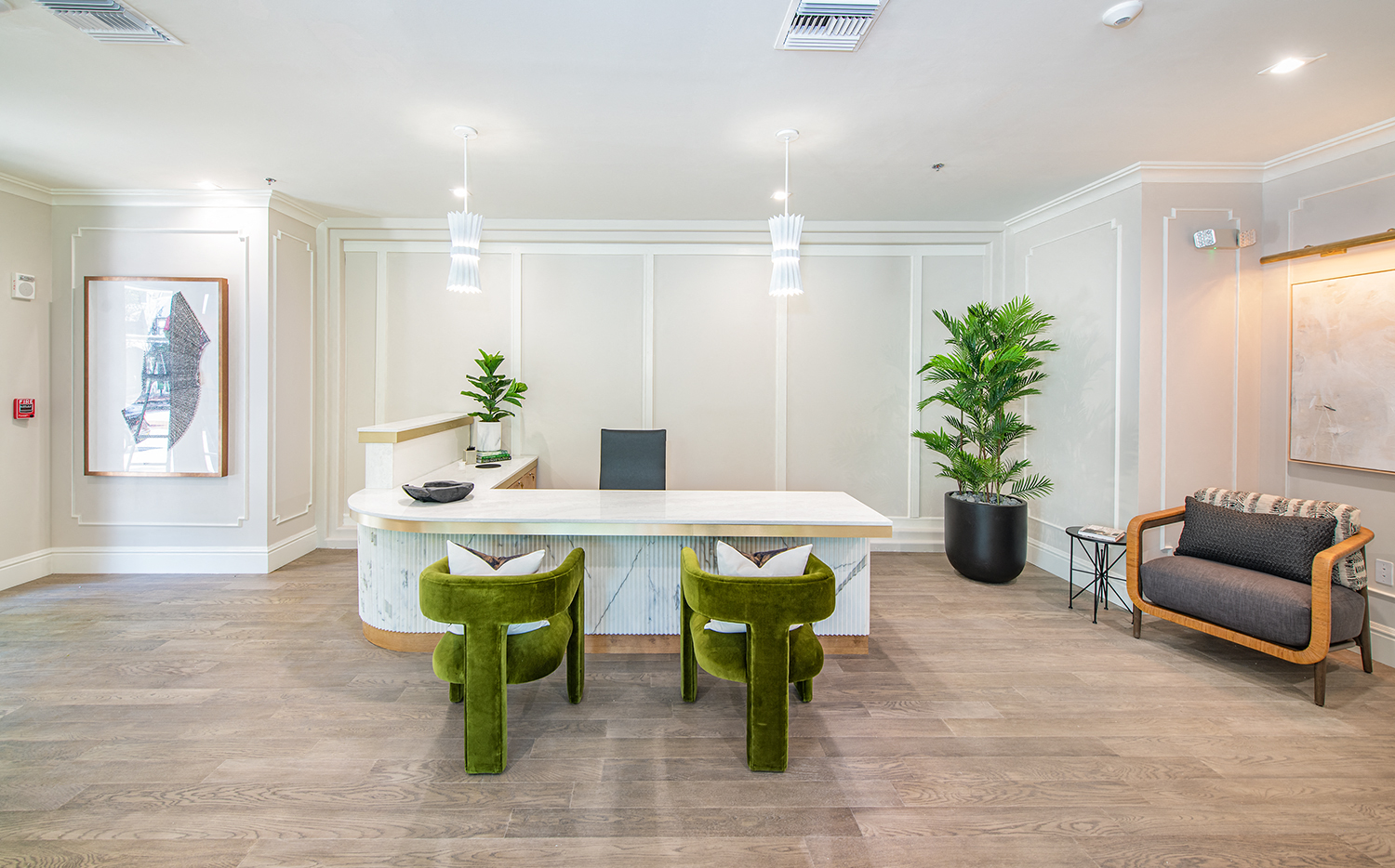 a conference room with green chairs and a white table