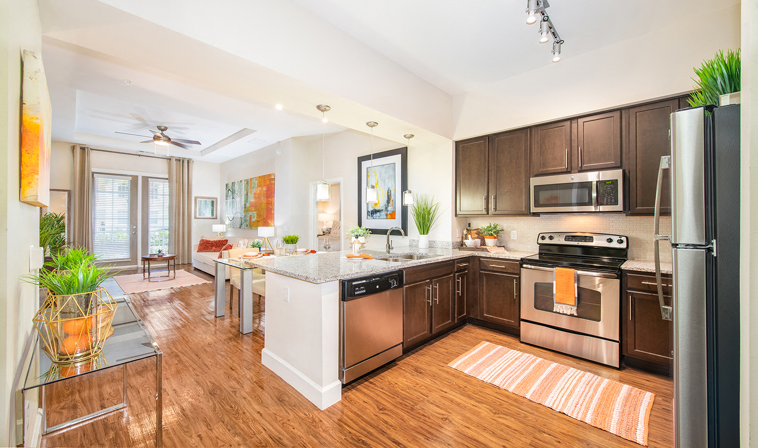 a large kitchen with stainless steel appliances and a large island
