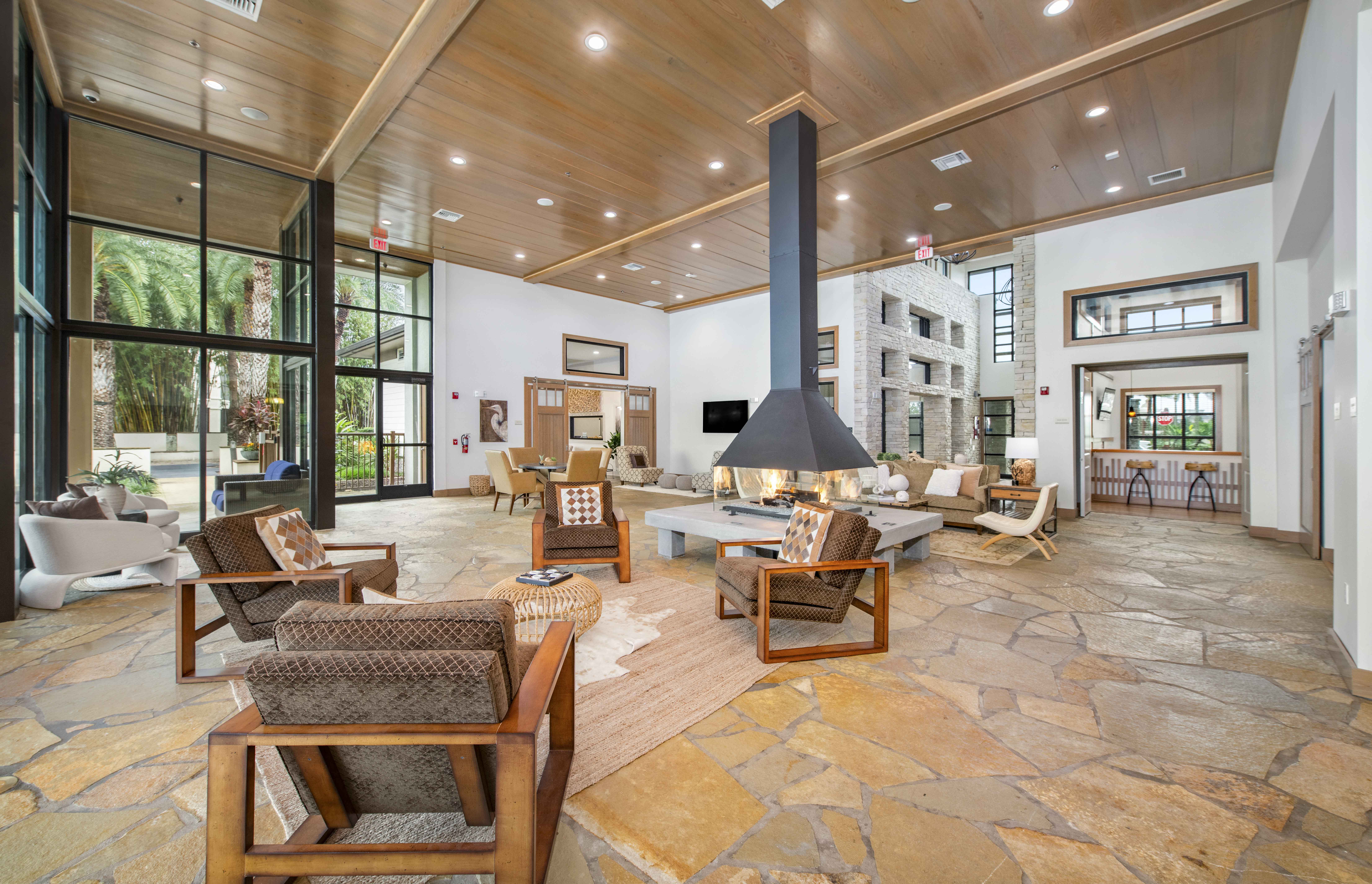 a large living room with furniture and a fireplace