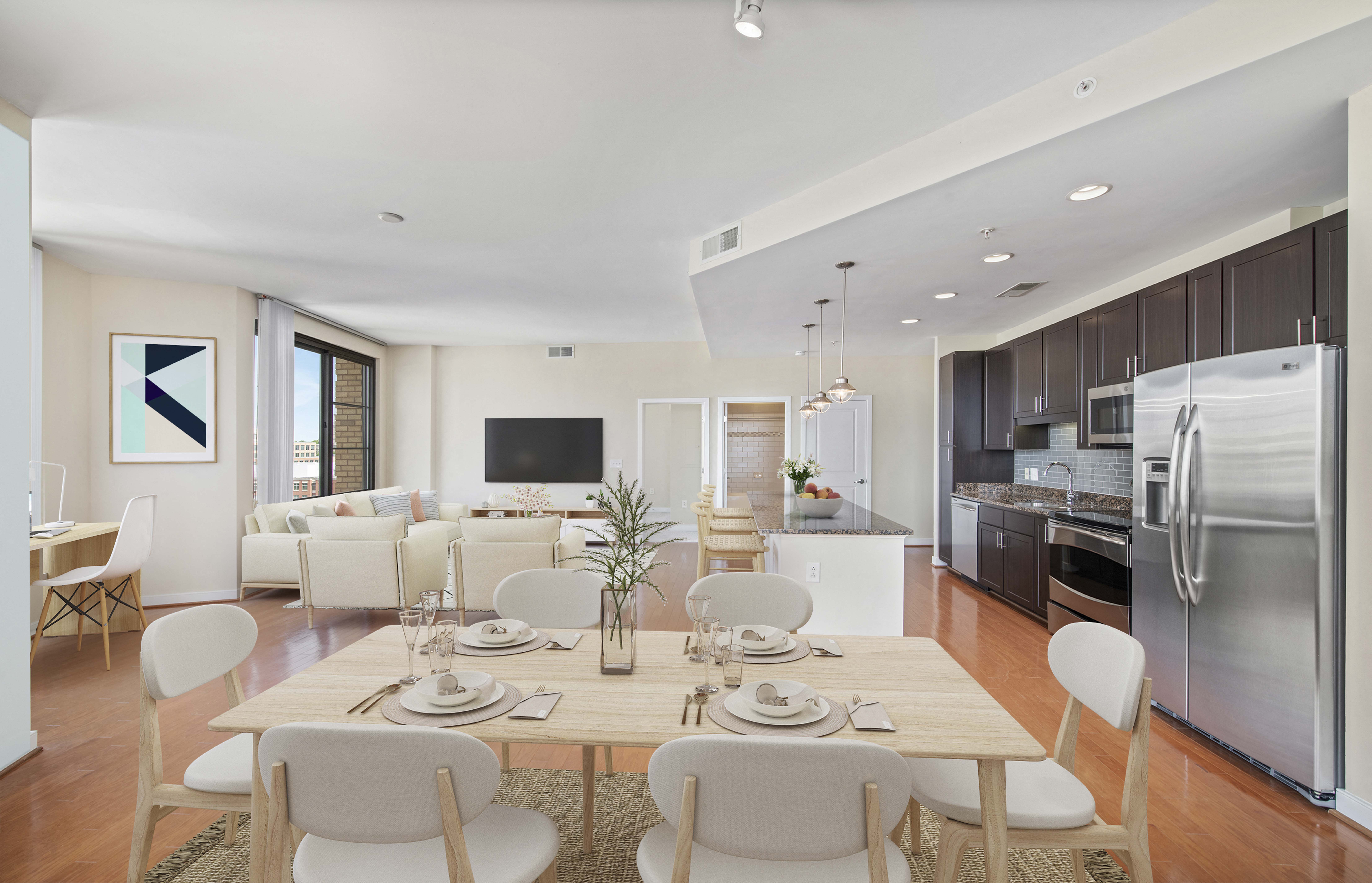 a kitchen and dining room with a table and chairs