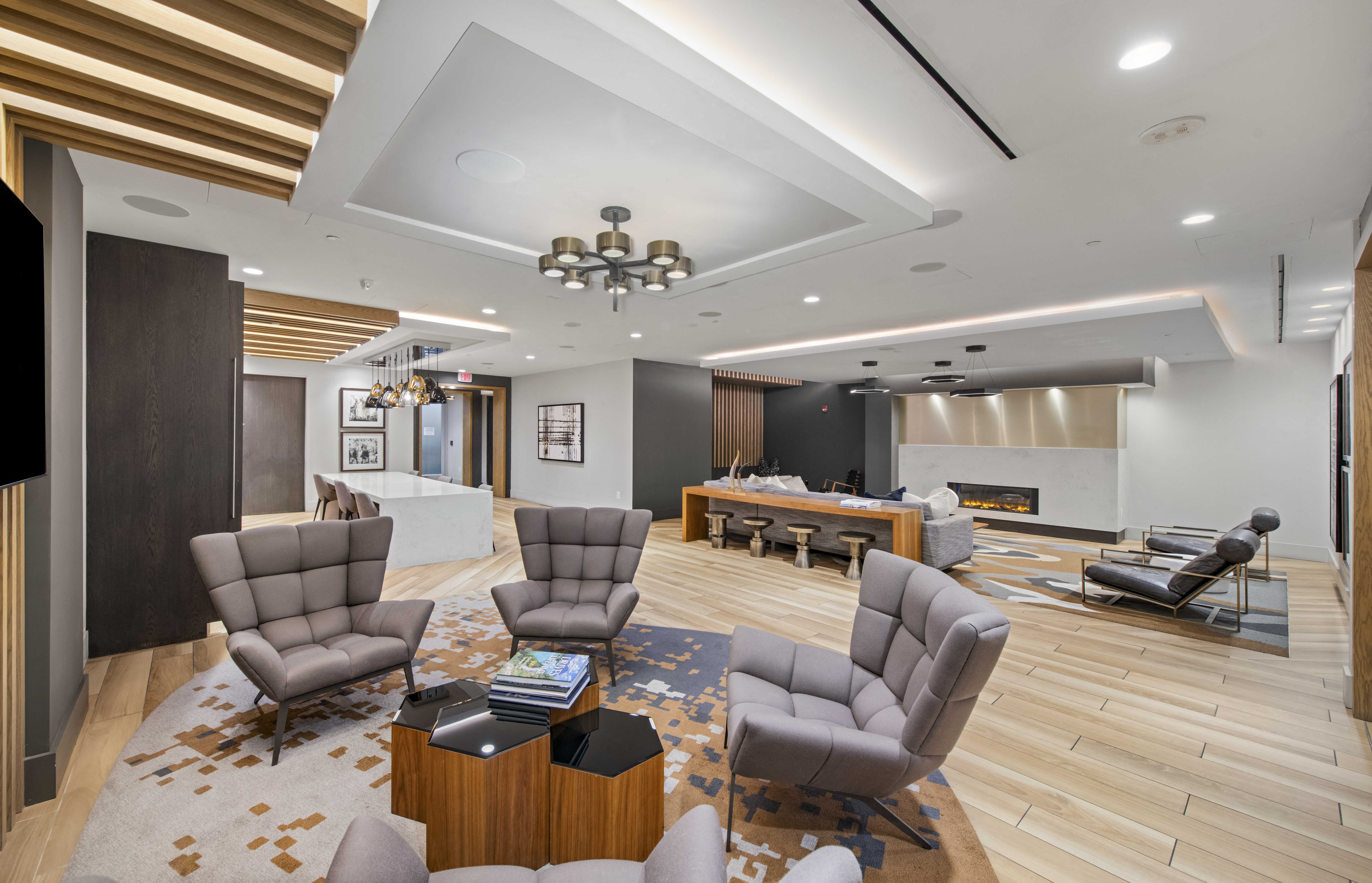 a living room with a couch and chairs and a table